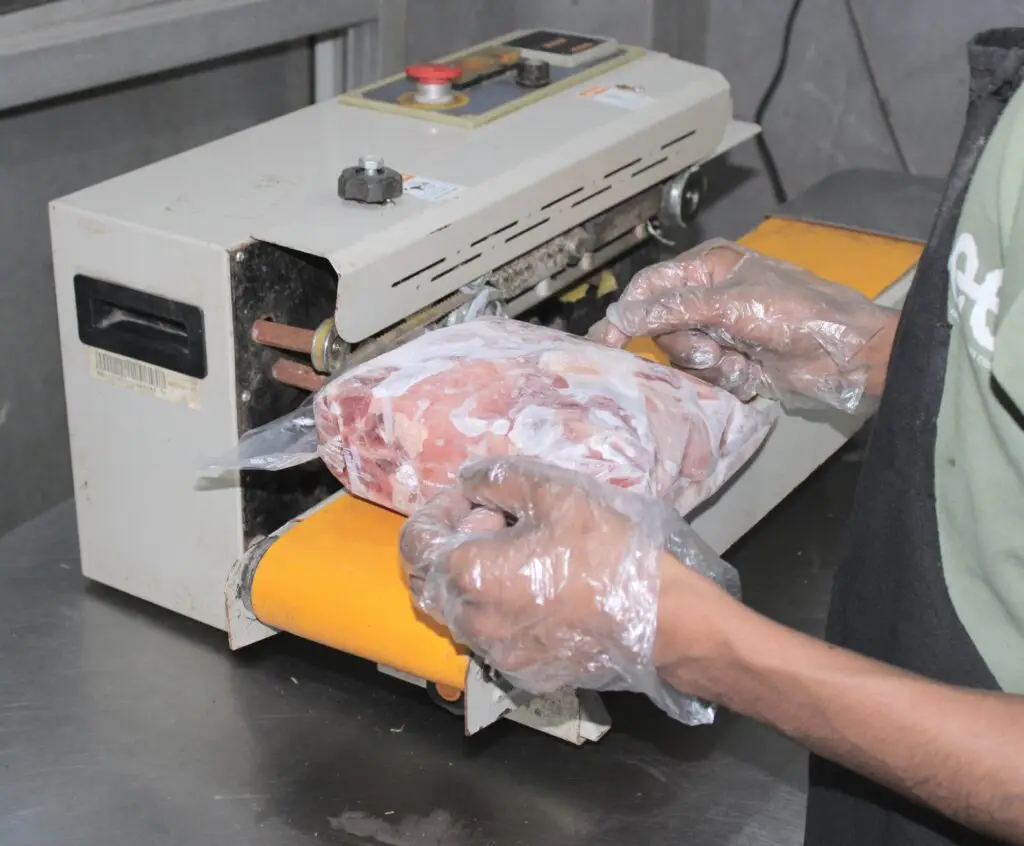 Meat packing machine